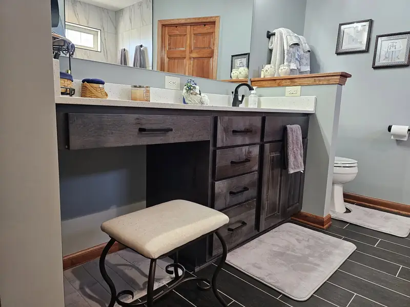 Bathroom vanity with a seated station and open knee clearance underneath