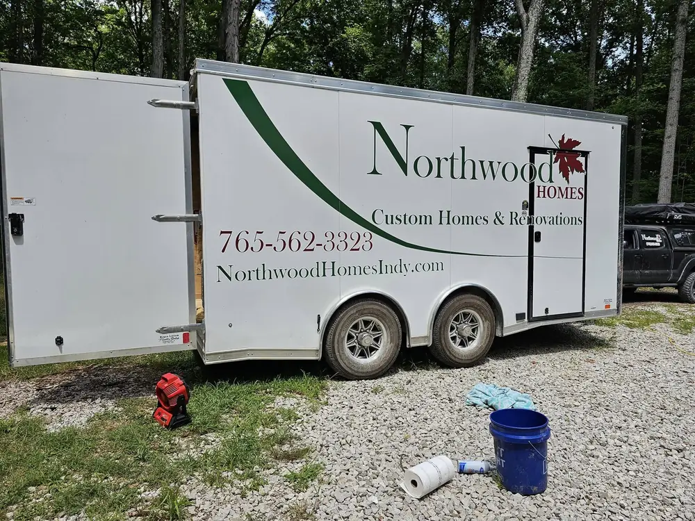 The Northwood Homes enclosed job trailer parked at a residential build site