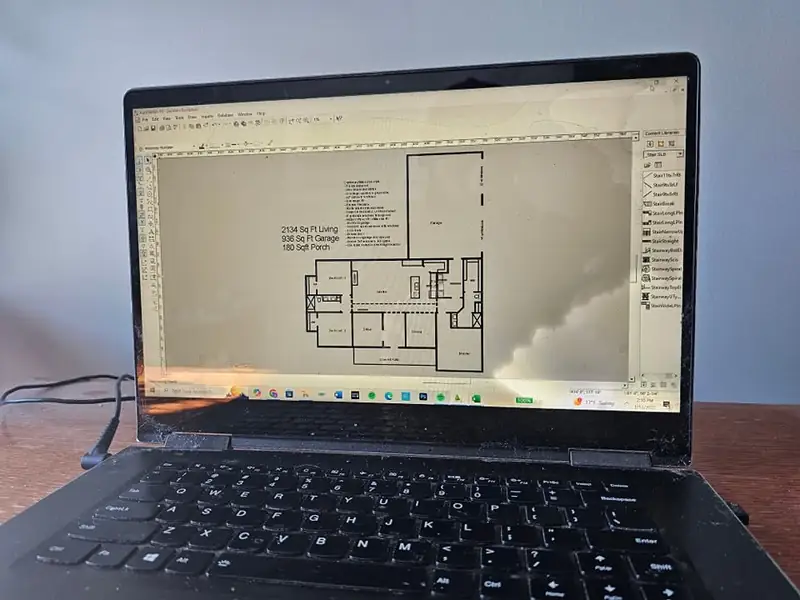 A Northwood Homes floor plan open in CAD on a laptop during pre-construction