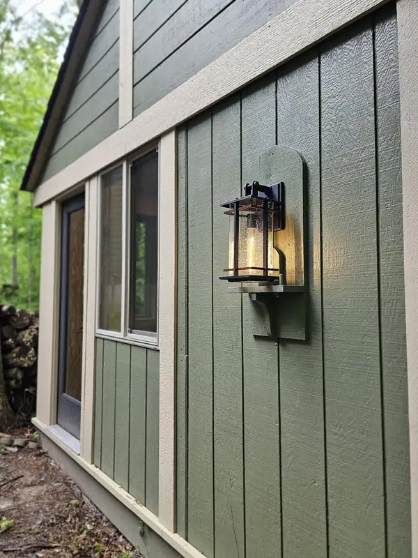 Board-and-batten exterior wall with a lantern sconce