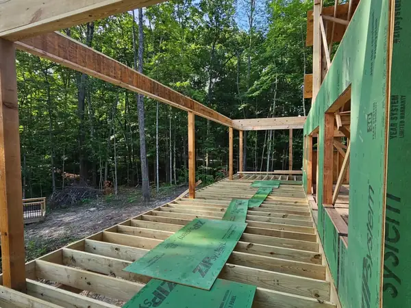 Floor deck and timber posts framed on a wooded lot